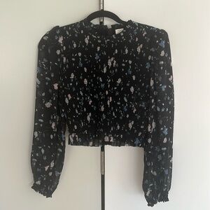 Black and floral blouse with sheer sleeves